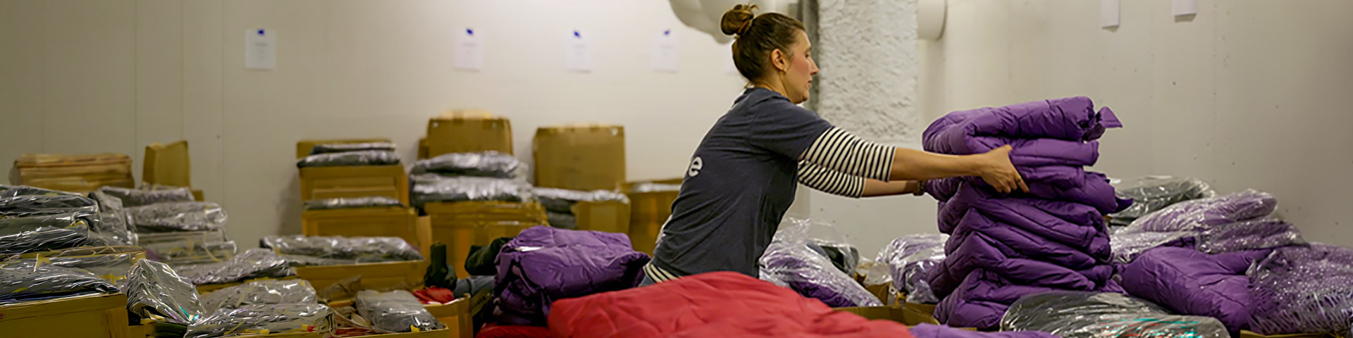 Service Credit Union volunteer packing jackets for Stay Warm program
