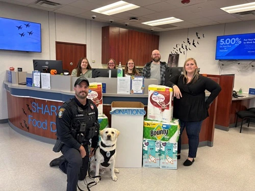 bank members at a booth