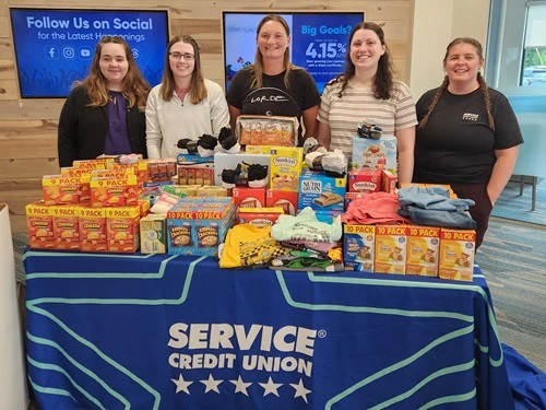 bank members displaying their gathered donatins