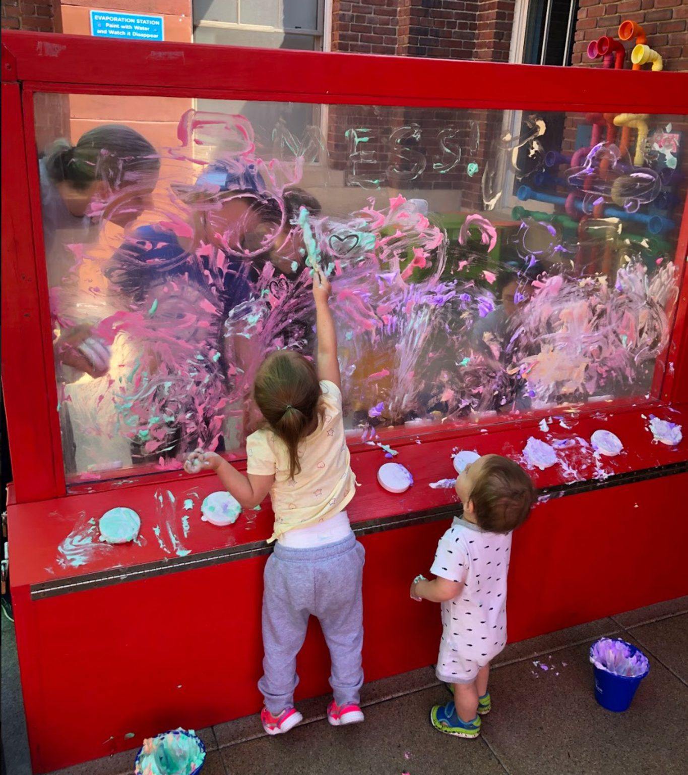 children playing with a window