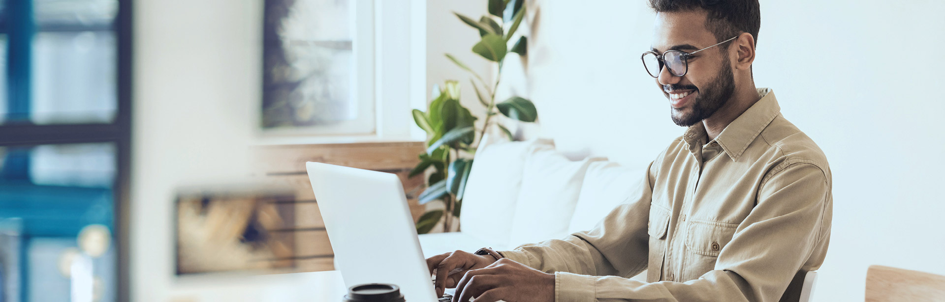 Gentleman smiling at their computer