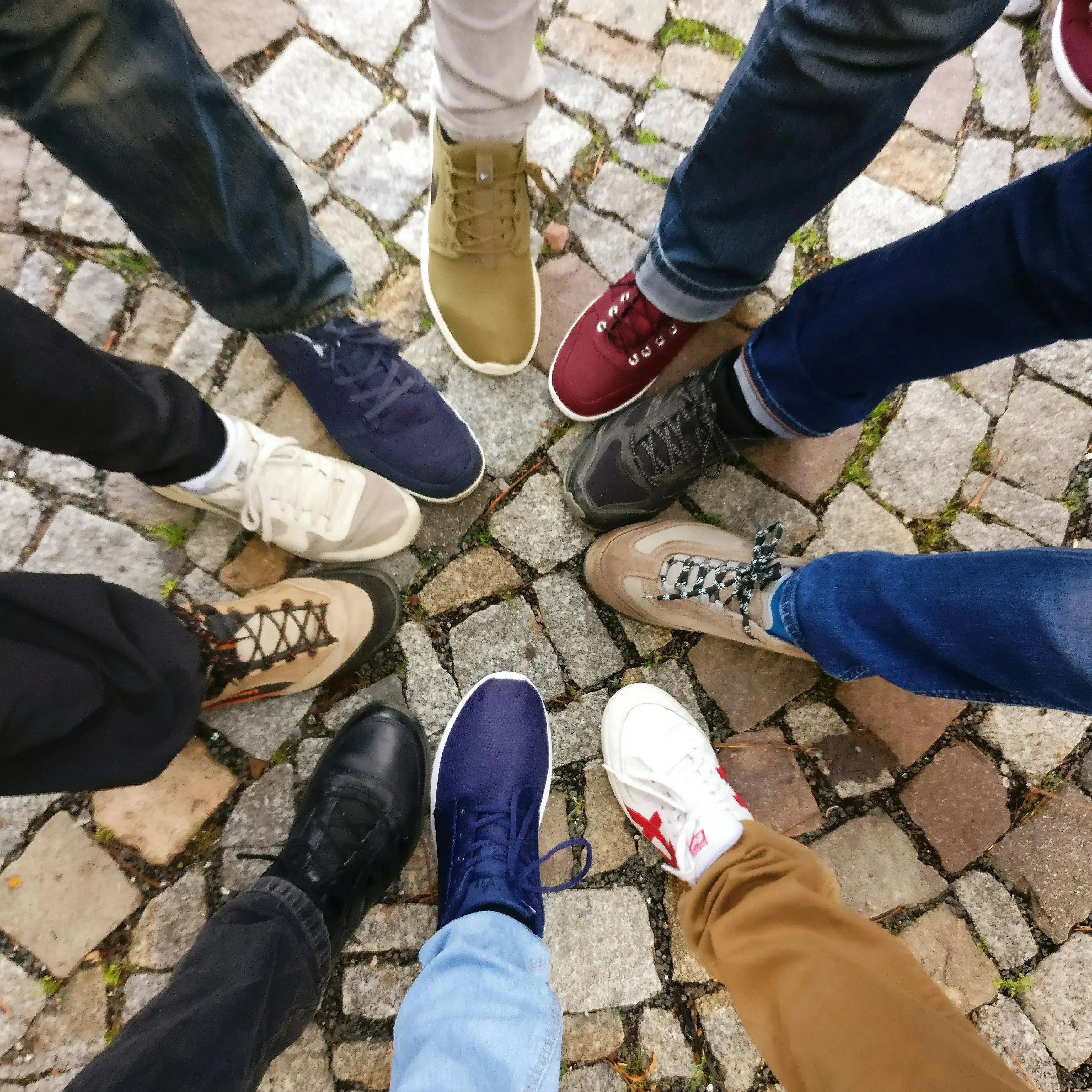 peoples' shoes in a circle