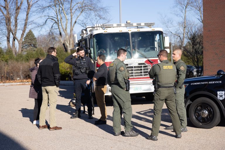 officers around a firetruck