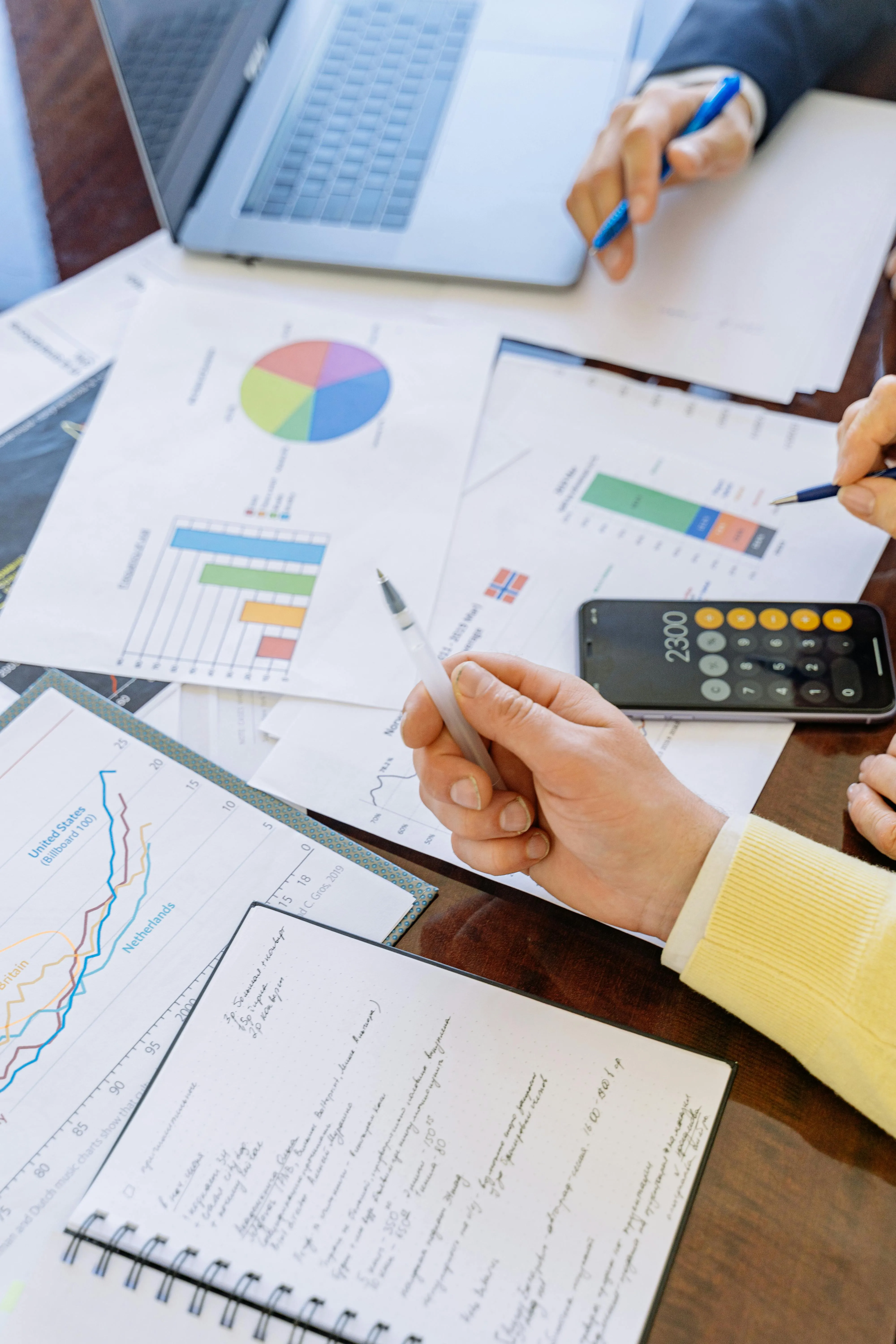 spreadsheets and calculators over a desk