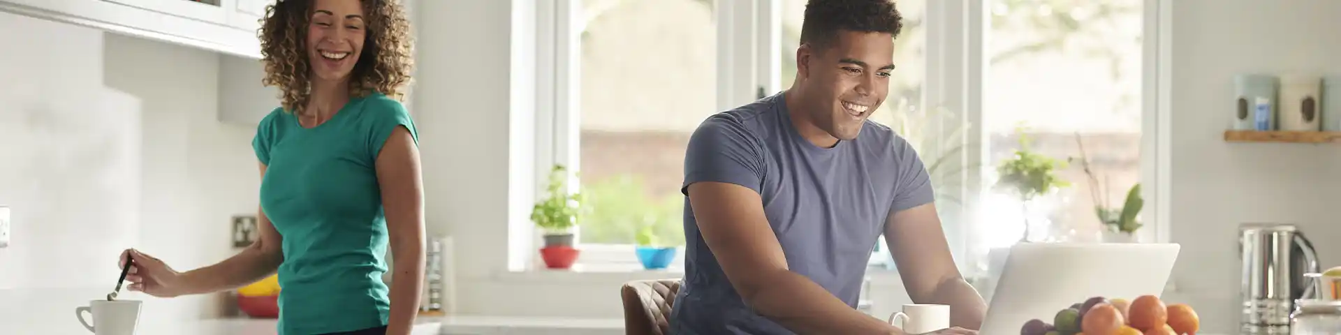 couple happy about their decision on the laptop