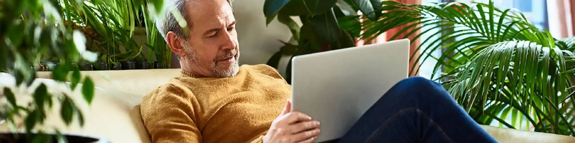 older gentleman accessing his laptop