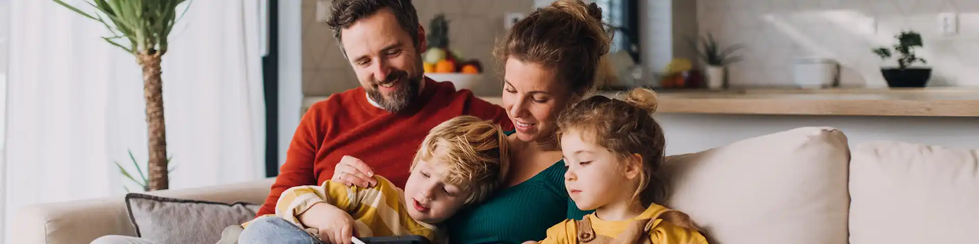 Parents and their children on the couch