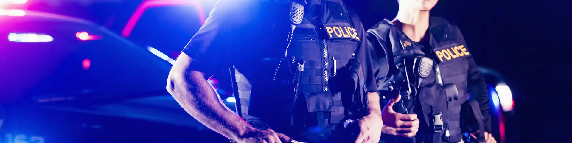 police officers and their cruiser