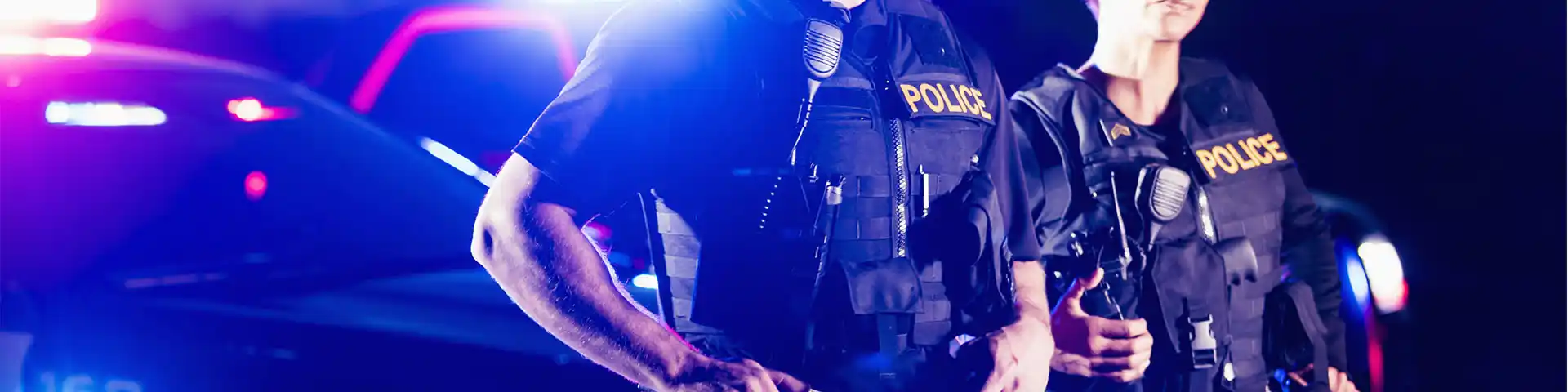 police officers and their cruiser