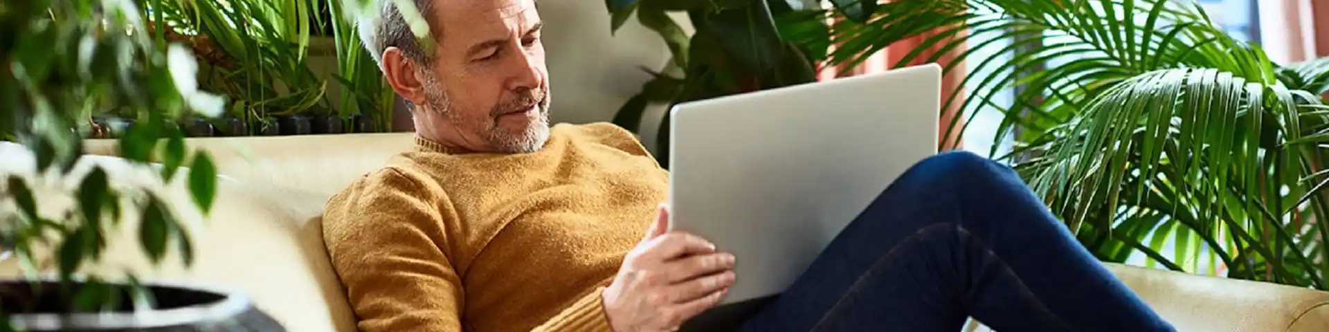 older gentleman accessing his laptop