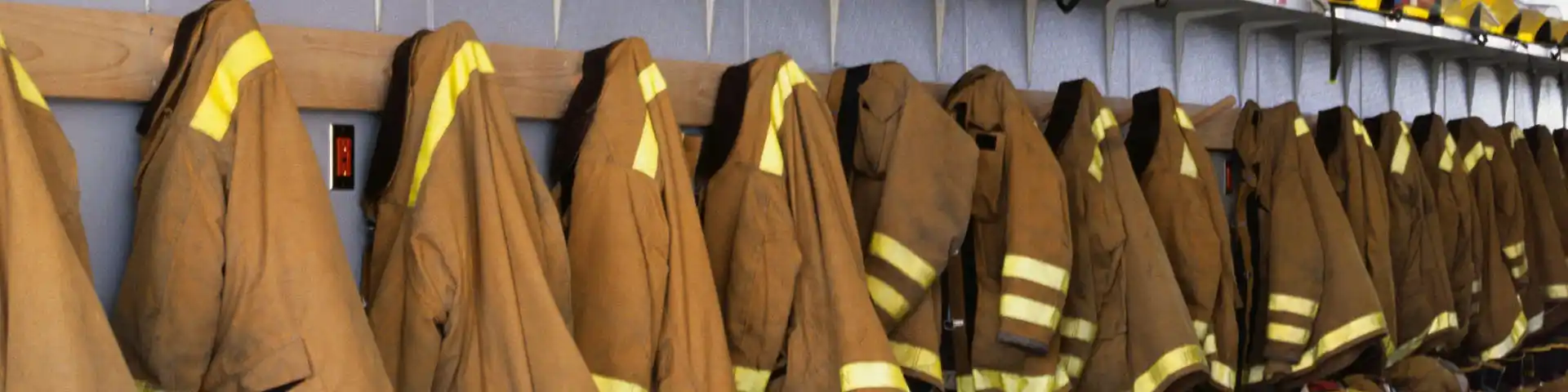 row of fireman jackets