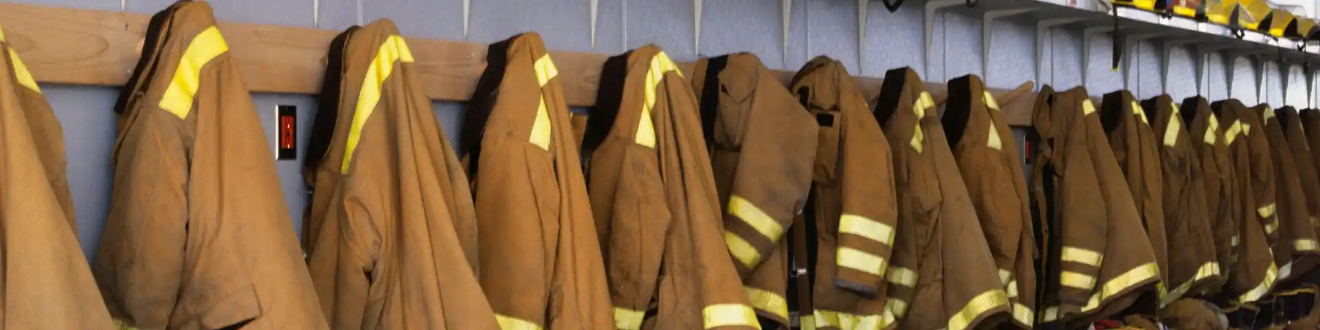 row of fireman jackets