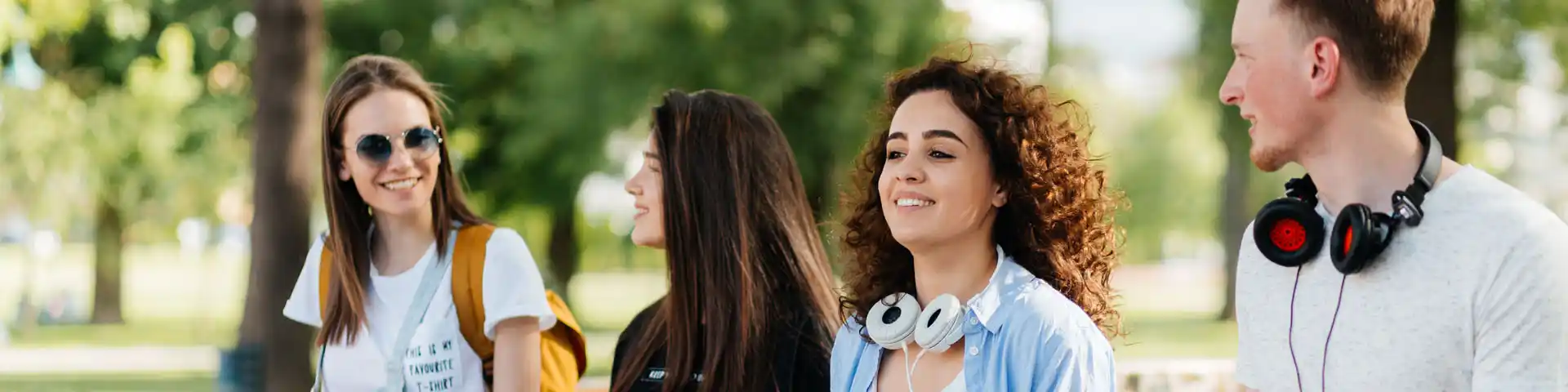 college students hanging out in the park