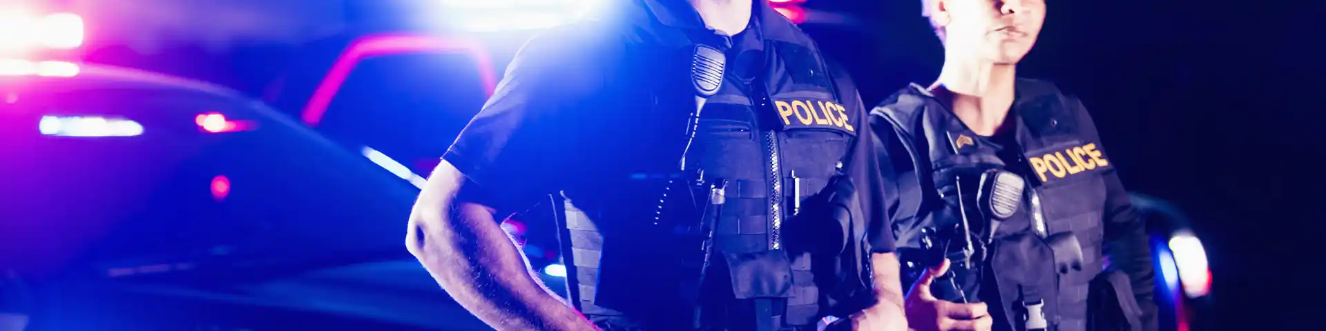 police officers and their cruiser