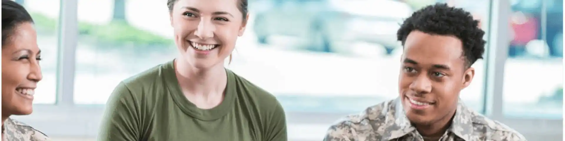 three veterans smiling