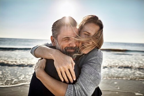 CoupleHuggingOnBeach