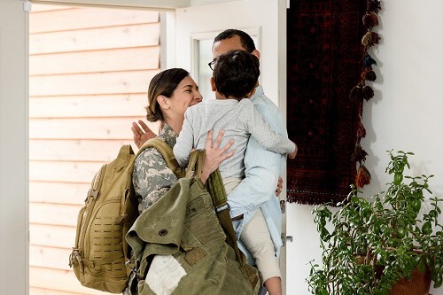 FemaleSoldierHuggingFamily