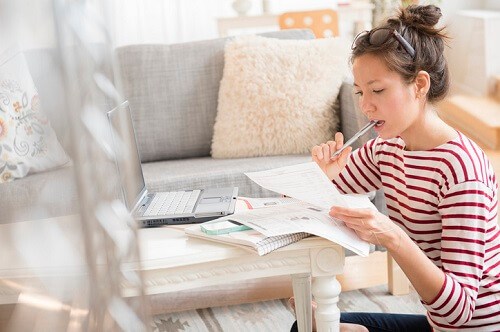 Woman-Reading-Bills