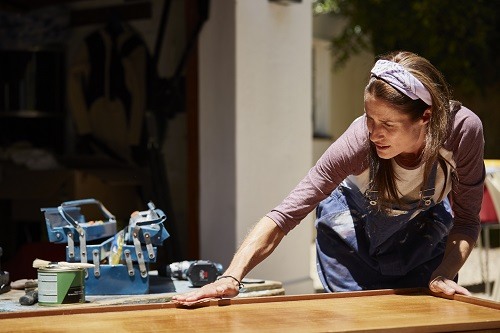 WomanPolishingTable
