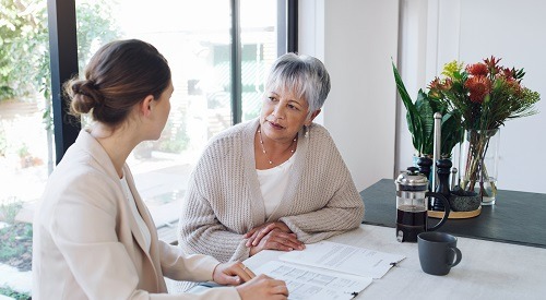 WomenSpeakingAtTable