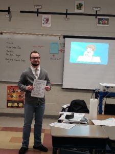 Nick from the Education Department in the 8th grade classroom.